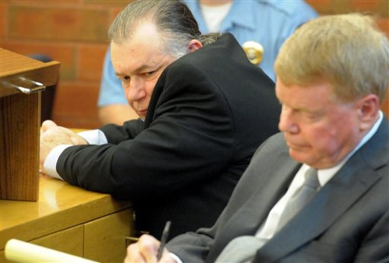 Richard Shenkman watches his attorney Hugh Keefe takes notes while final evidence and witnesses are presented on Friday.